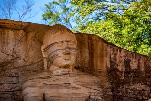 Ancient ruins of Polonnaruwa with stone carvings
